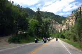 A group of bikes riding through a scenic landscape
