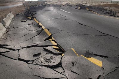 A road torn up by an earthquake.