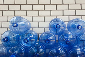 Gallon jugs of water stacked up.