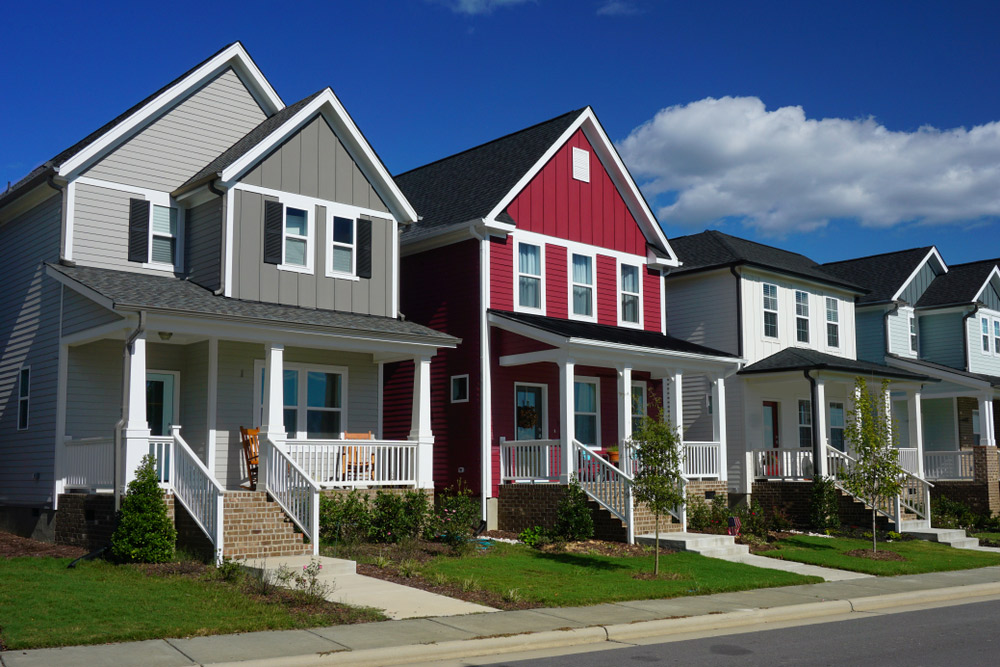 Front view of several different colored row homes (opens in new window)