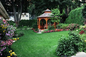 A well manicured lawn with a gazebo
