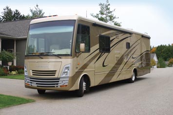 An RV parked outside home being prepared for a safe trip