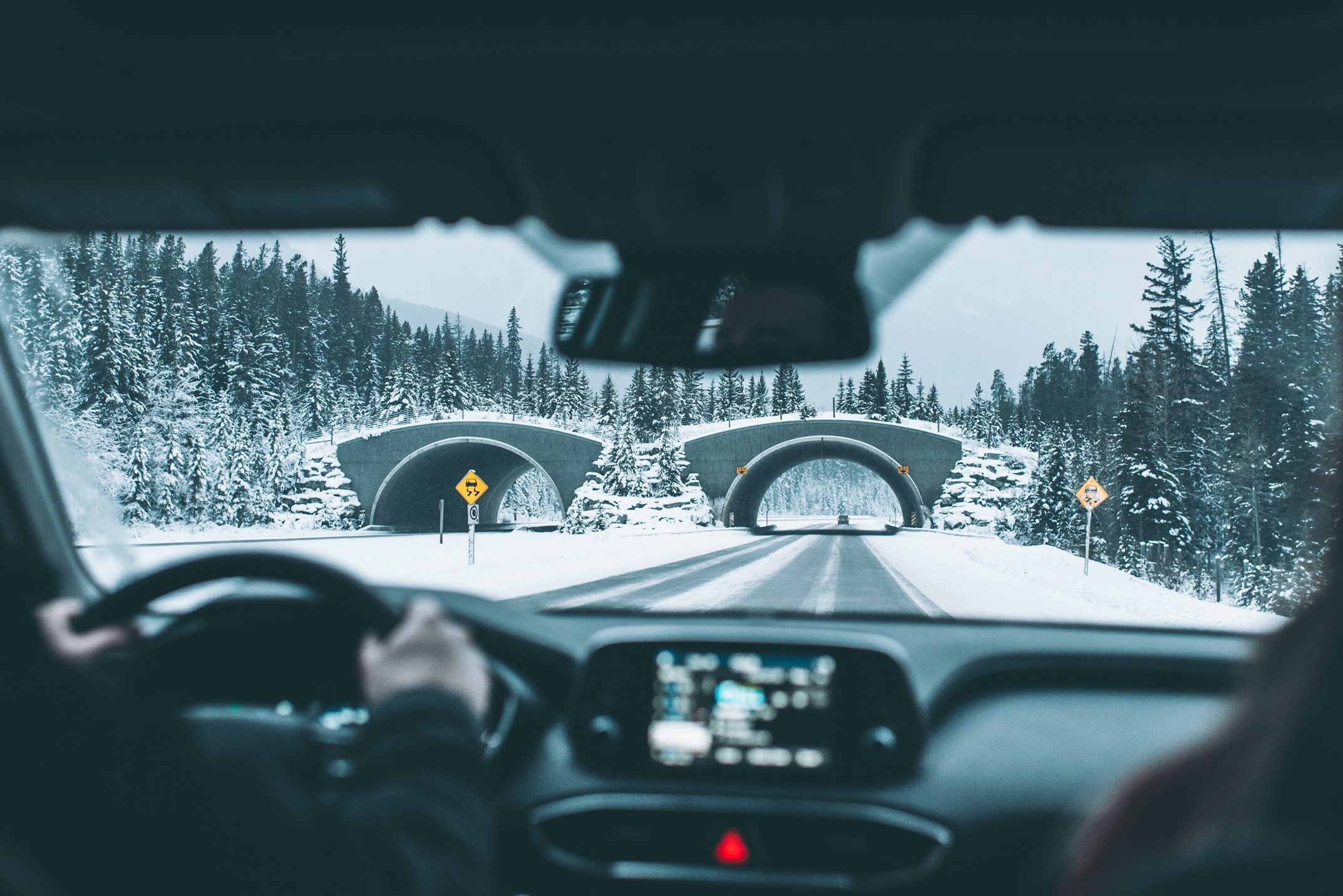 View from inside a car on snow covered roads
